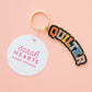 Keychain with 'Quilter' design and 'Sarah Hearts' tag on a pink background